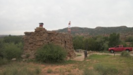 Micah at the top of these stone cabins in the canyon south of Amarillo